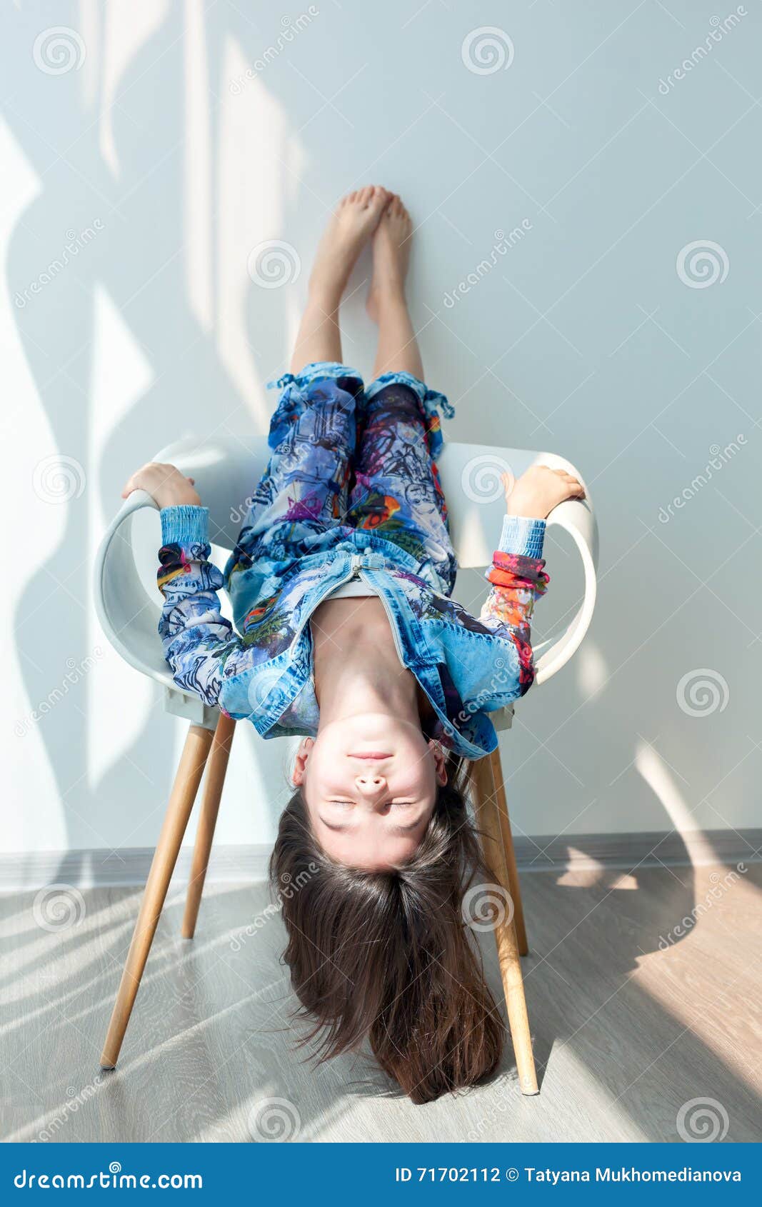 Portrait Of Nice Little Girl Upside Down On A White Chair Stock Photo Image Of Model