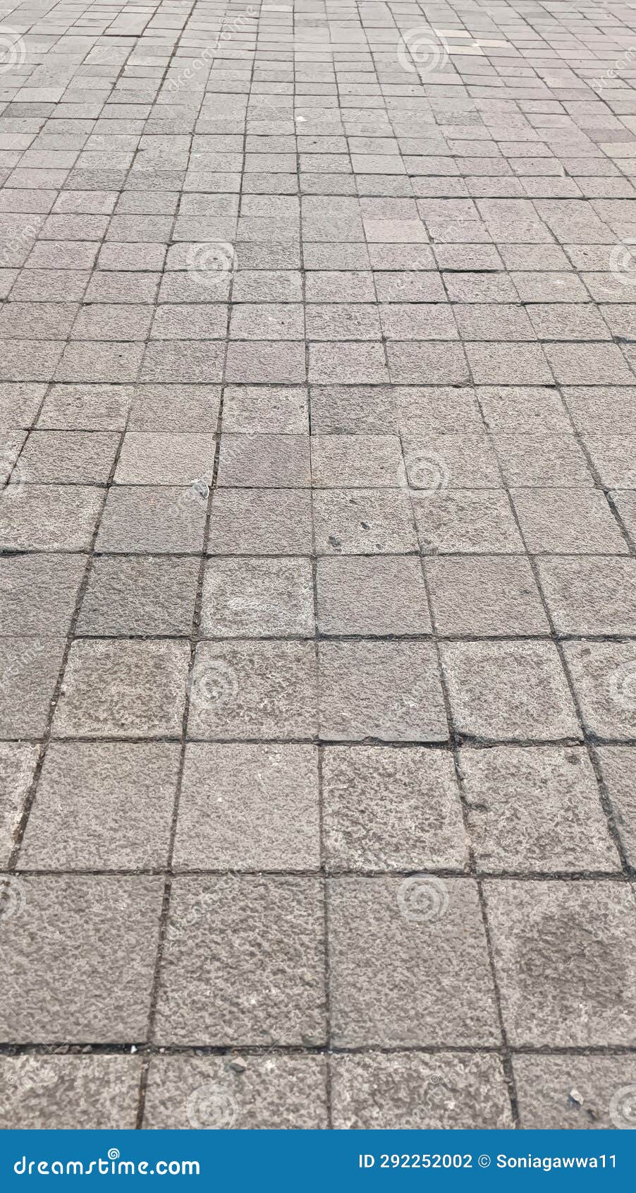 Portrait of Outdoor Stone Tile Flooring in Square Patterns Stock Photo