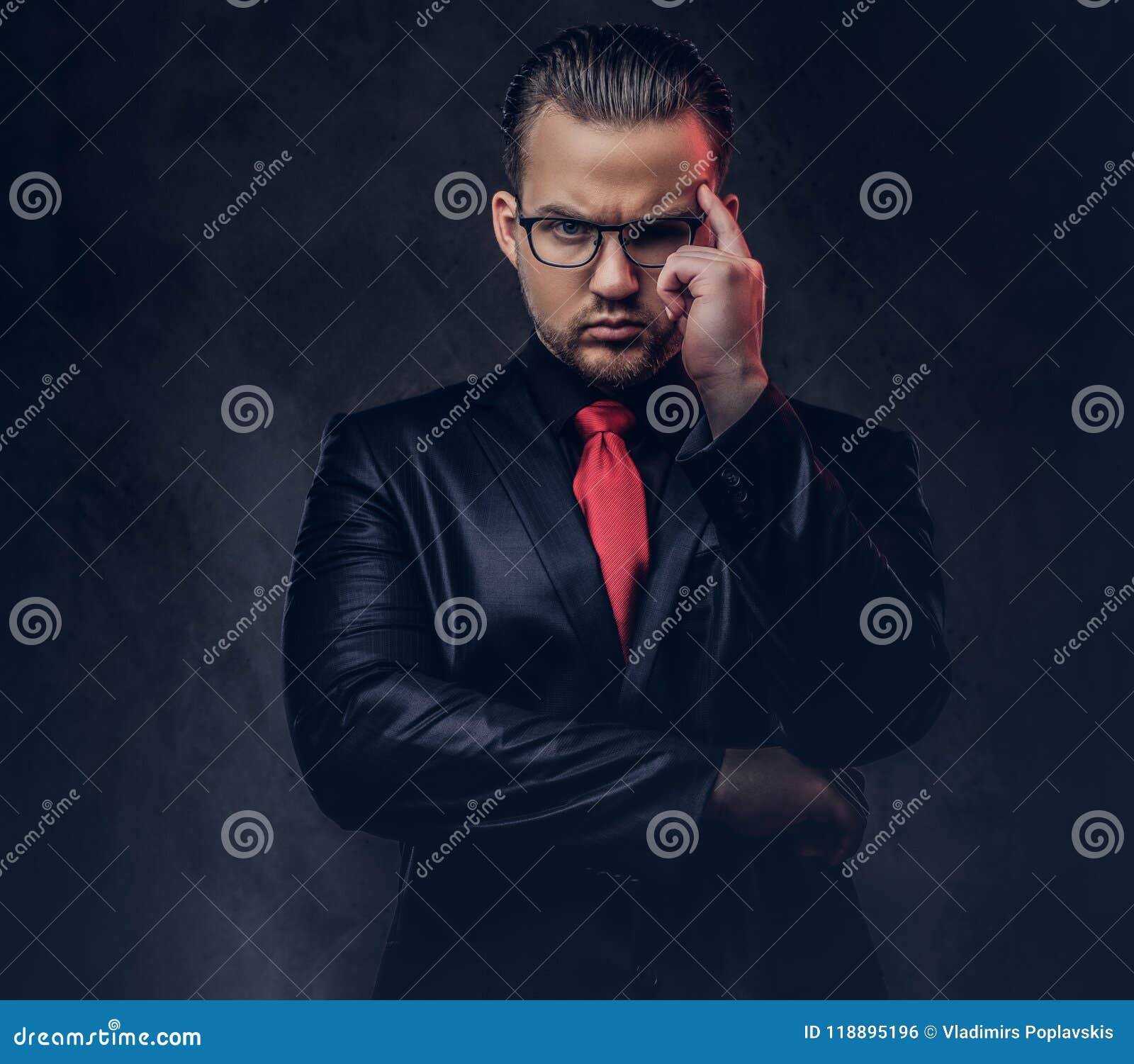 Portrait of a Pensive Stylish Male in a Black Suit and Red Tie. Stock ...