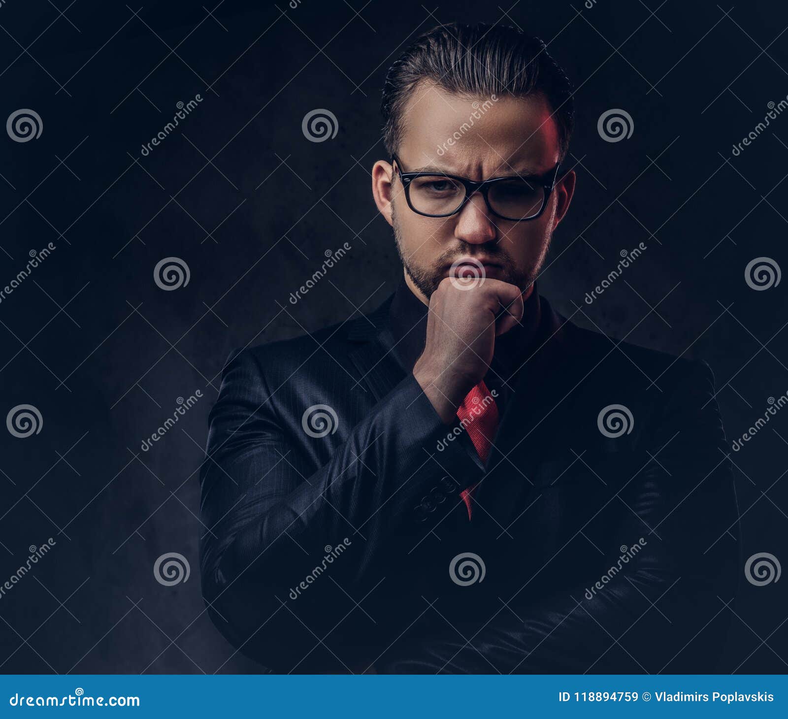 Portrait Of A Pensive Stylish Male In A Black Suit And Red Tie. Stock ...