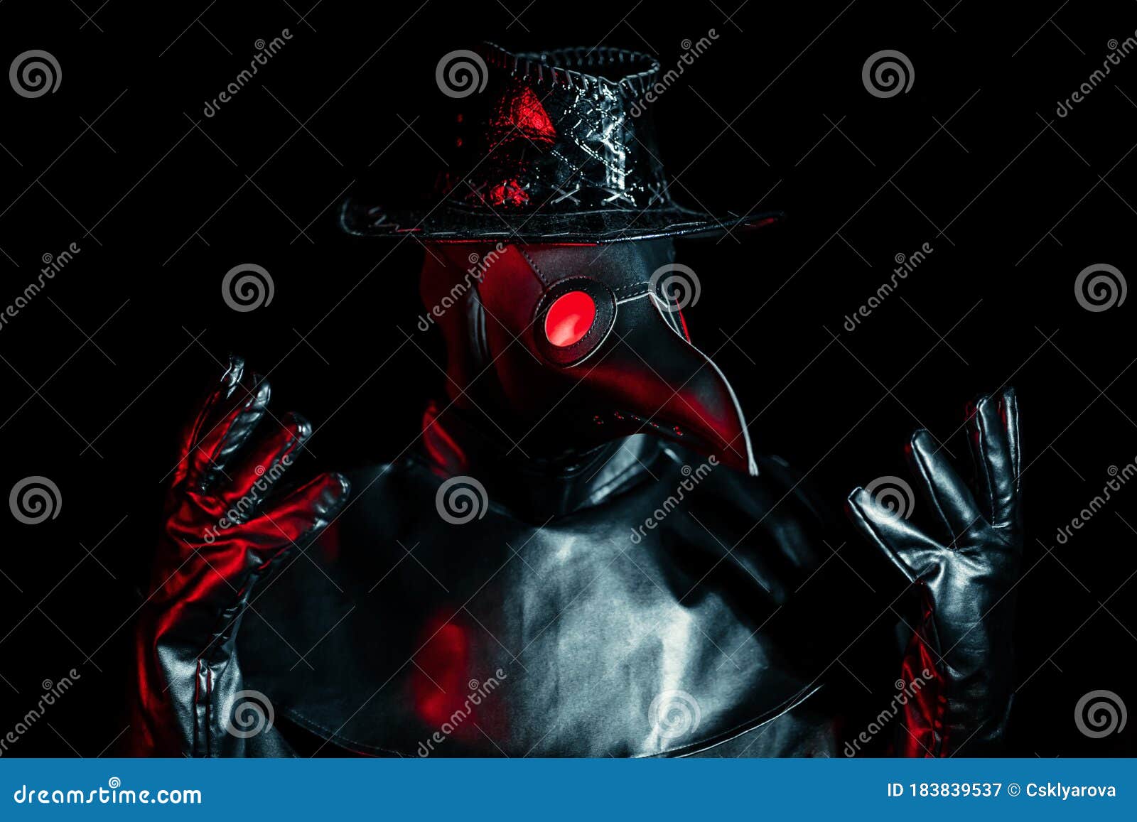 portrait of plague doctor with crow-like mask  on black background. creepy mask, halloween, historical terrible