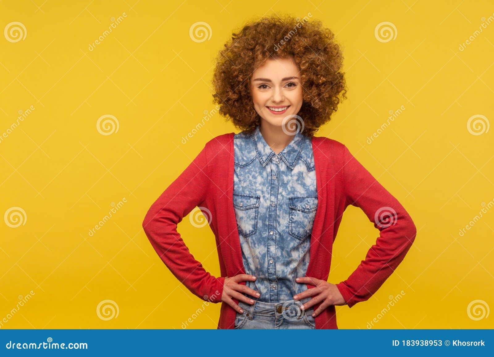 Portrait Of Positive Woman With Fluffy Curly Hair In Casual Style Jeans ...