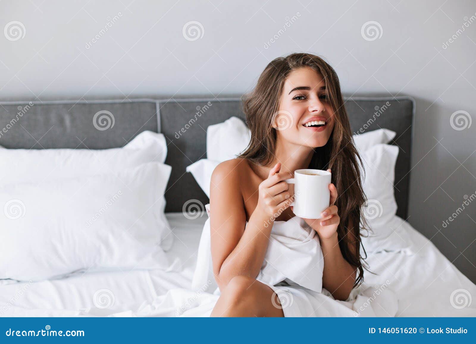Portrait Pretty Girl With Naughty Shoulders Drinking Coffee On Bed In