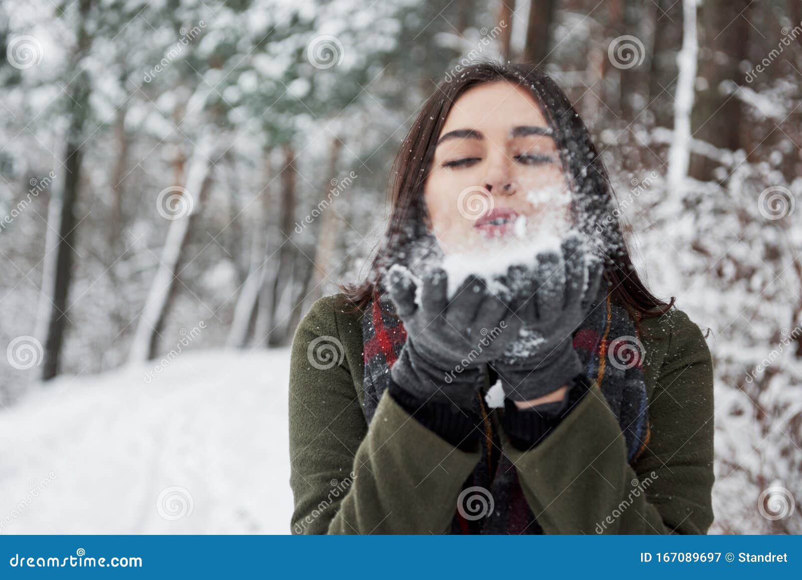 Portrait of Pretty Woman Blowing Snow in the Forest at Daytime Stock ...