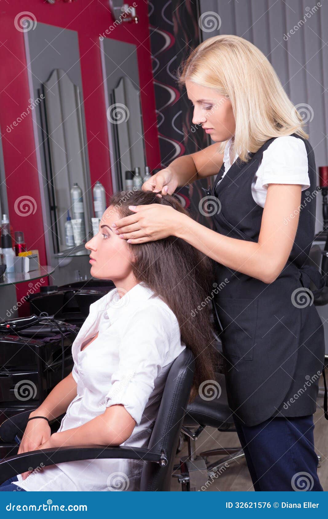 Portrait Of Professional Hairdresser At Work In Beauty 