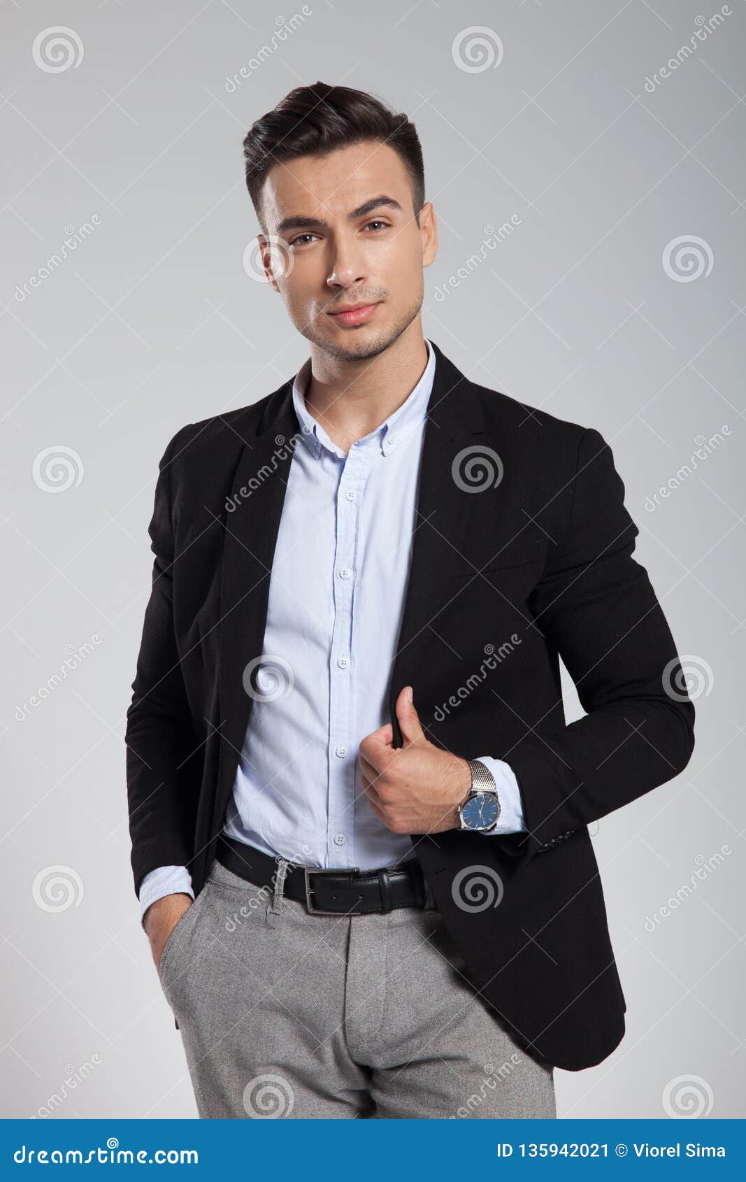 Portrait of Relaxed Young Businessman Holding Black Suit Collar Stock ...