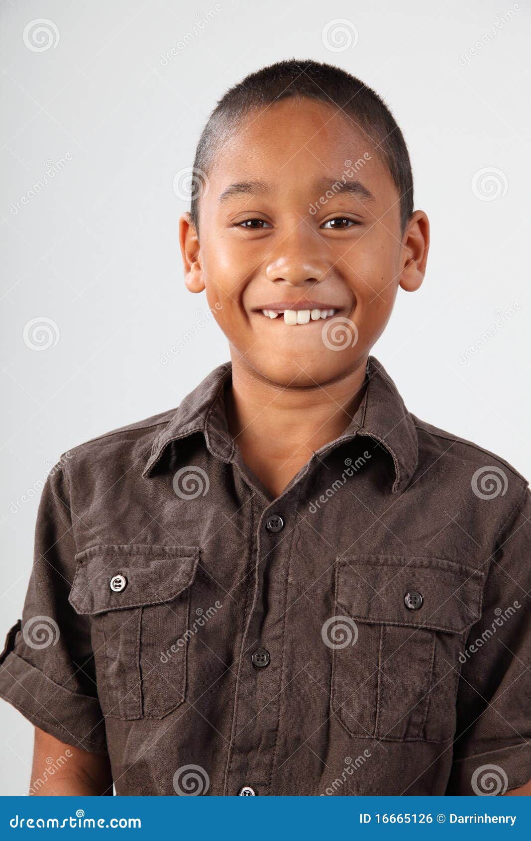 portrait of schoolboy 9 with huge toothy smile