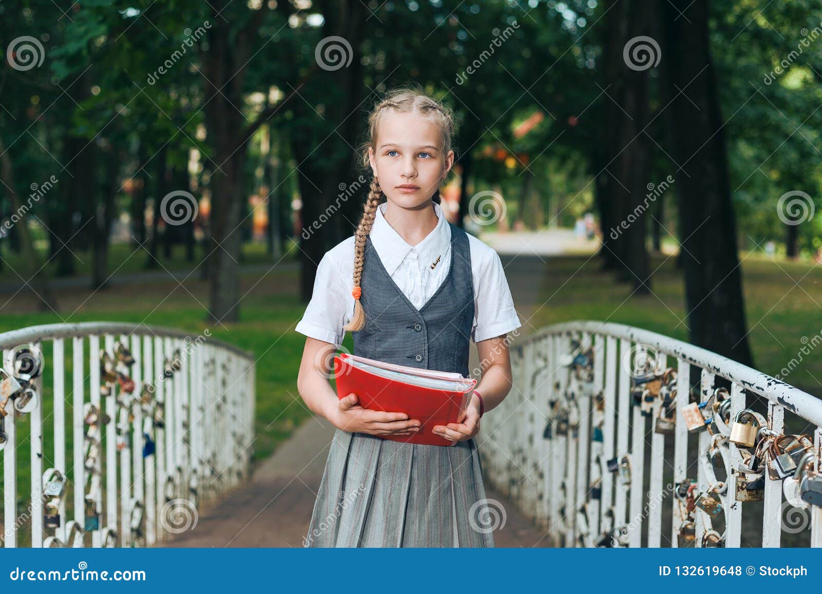 Schoolgirl Teenager With Pigtails With Books And Noteb