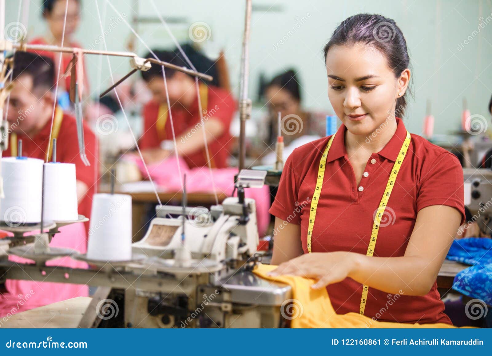 Seamstress in Textile Factory Sewing Using Industrial Sewing Mac Stock ...