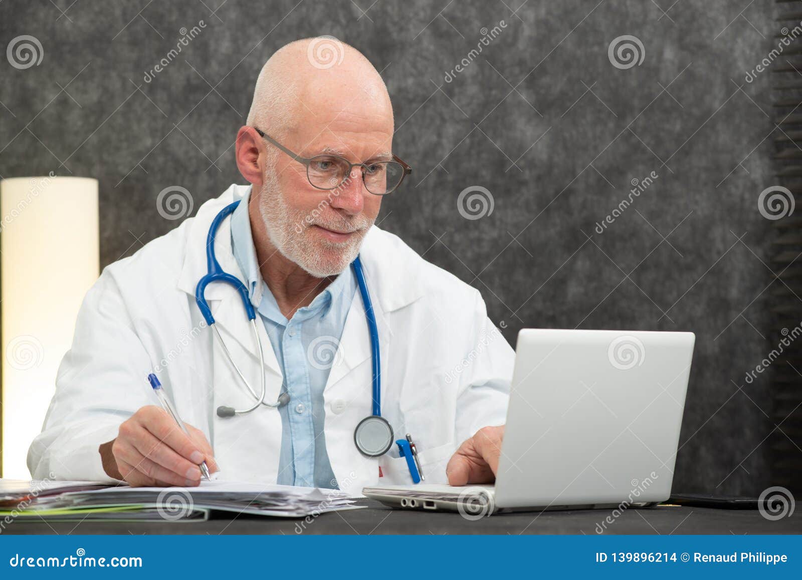 Portrait of Senior Doctor Sitting in Medical Office Stock Photo - Image ...