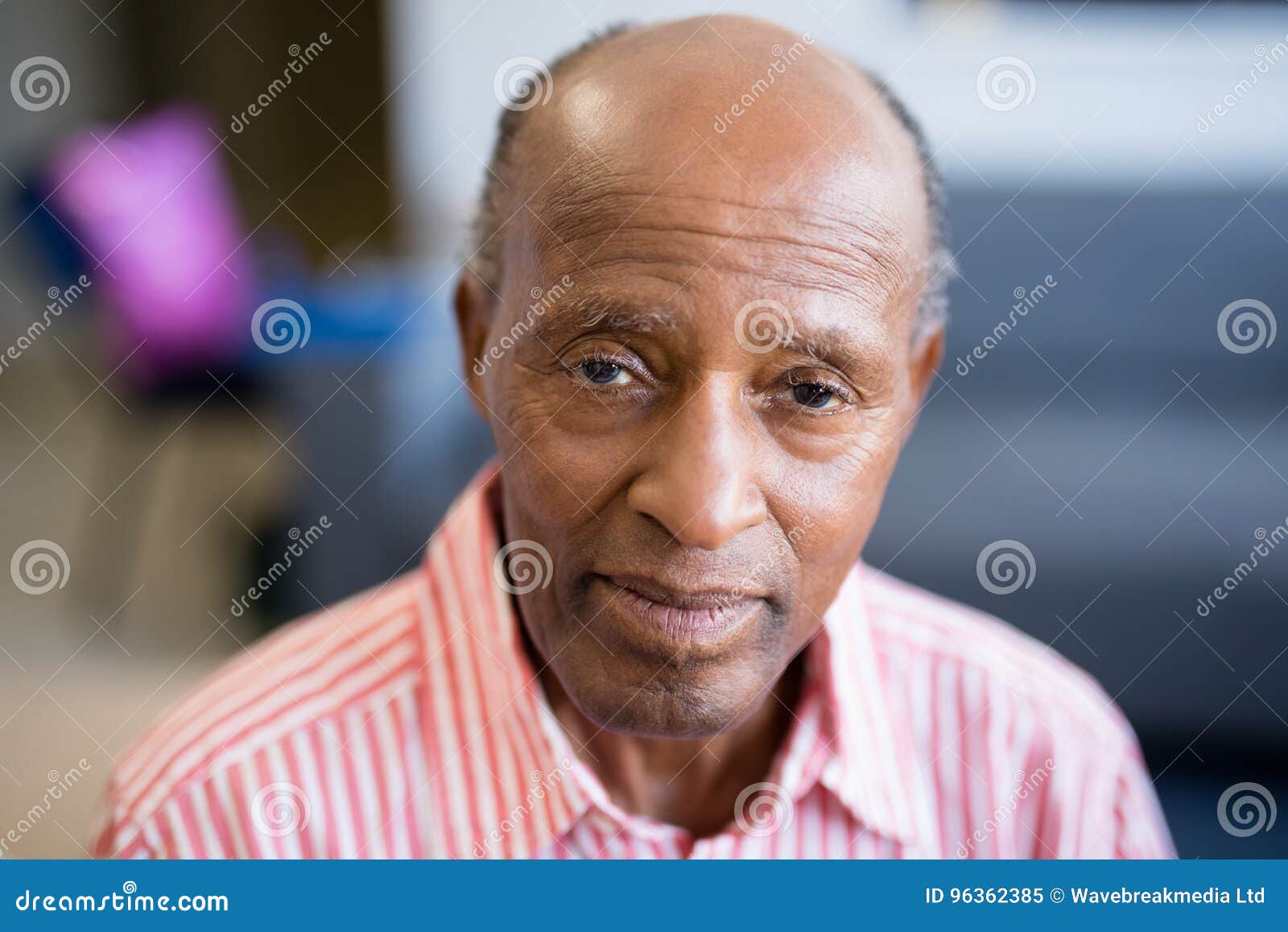 portrait of senior man with receding hairline