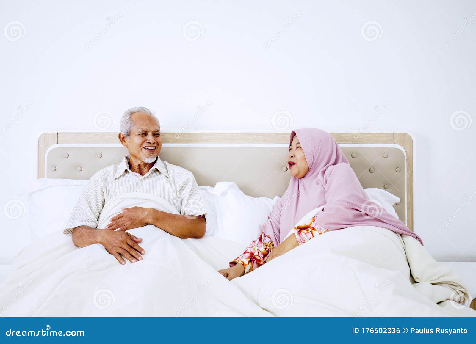 Senior Muslim Couple Talking on Bedroom Stock Photo - Image of ...