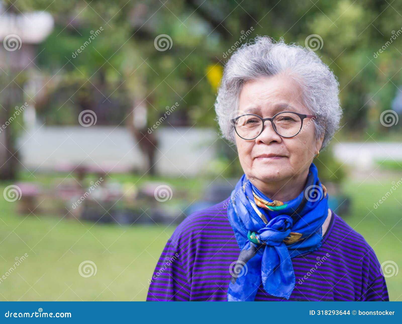 Portrait of a Senior Woman with Short Gray Hair, Wearing Glasses