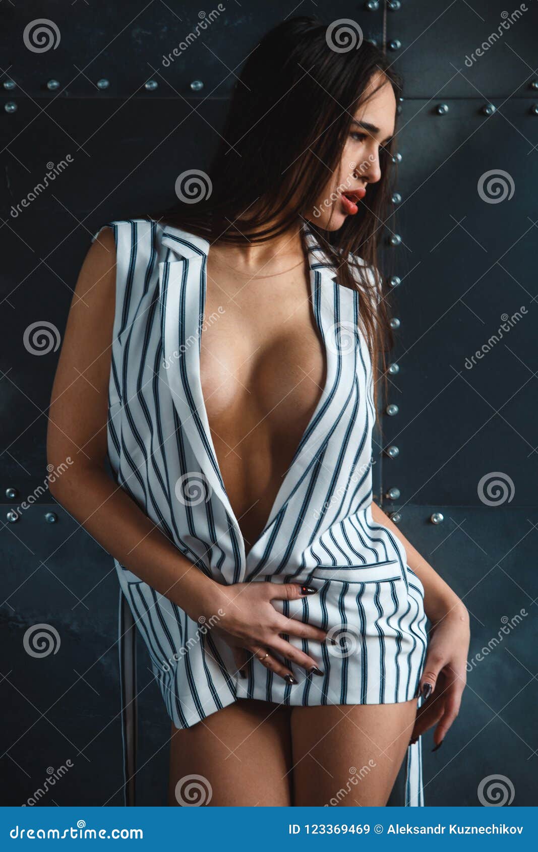 Portrait of Brunette Woman with a Perfect Body and Large Breasts