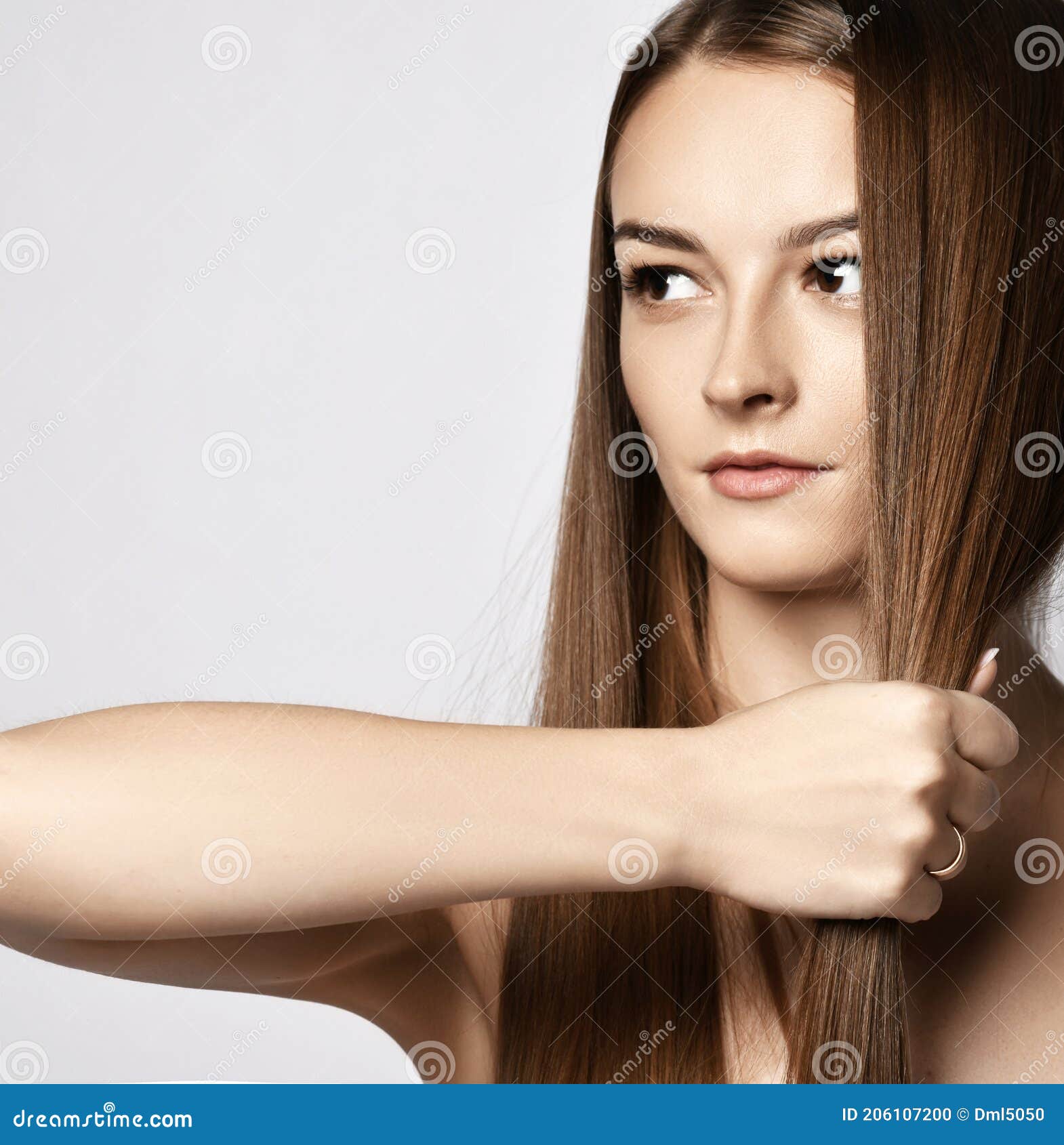 Portrait of Sensual Young Woman Holding Strand of Her Long Silky Hair in Her Fist Demonstrating it Strength and Health Stock Photo - Image of face, beauty: 206107200 Portrait of Sensual Young Woman Holding Strand of Her Long Silky Hair in Her Fist Demonstrating it Strength and Health Stock Photo - Image of face, beauty: 206107200