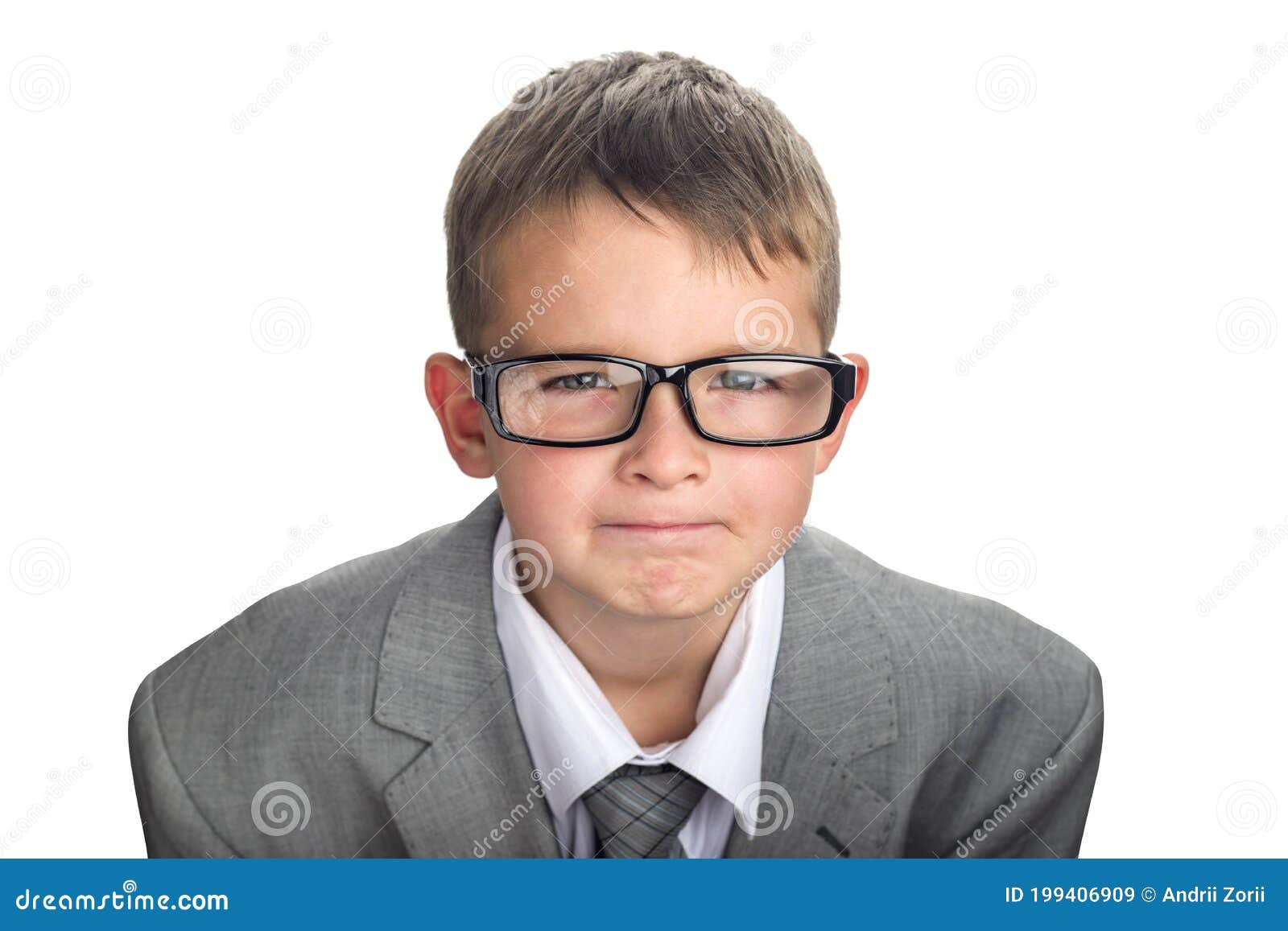 portrait of a serious child dressed in a business suit and glasses as a businessman. face of smart boy in glasses and adult suit