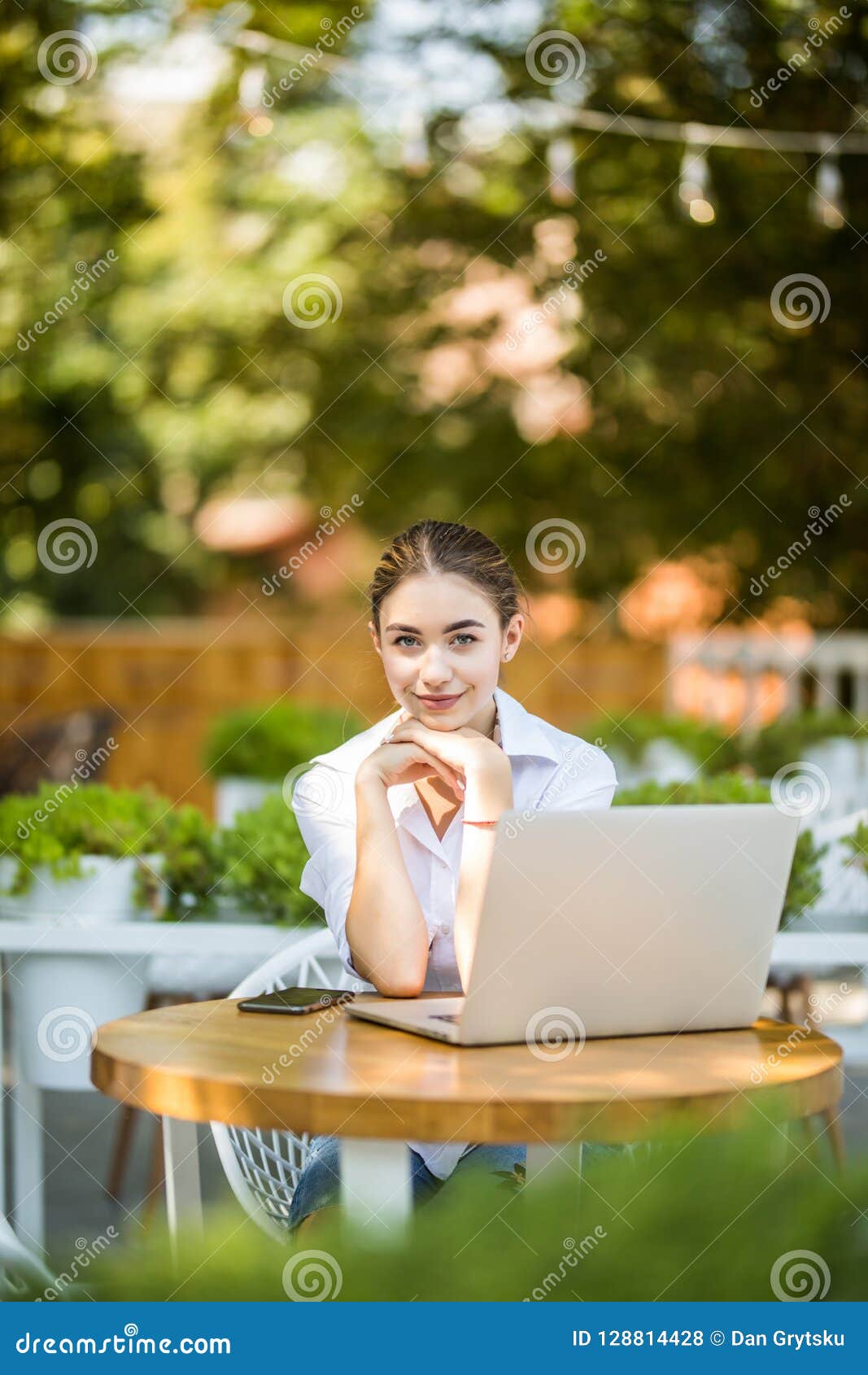 Portrait of Serious Female Student or Freelancer with Laptop ...