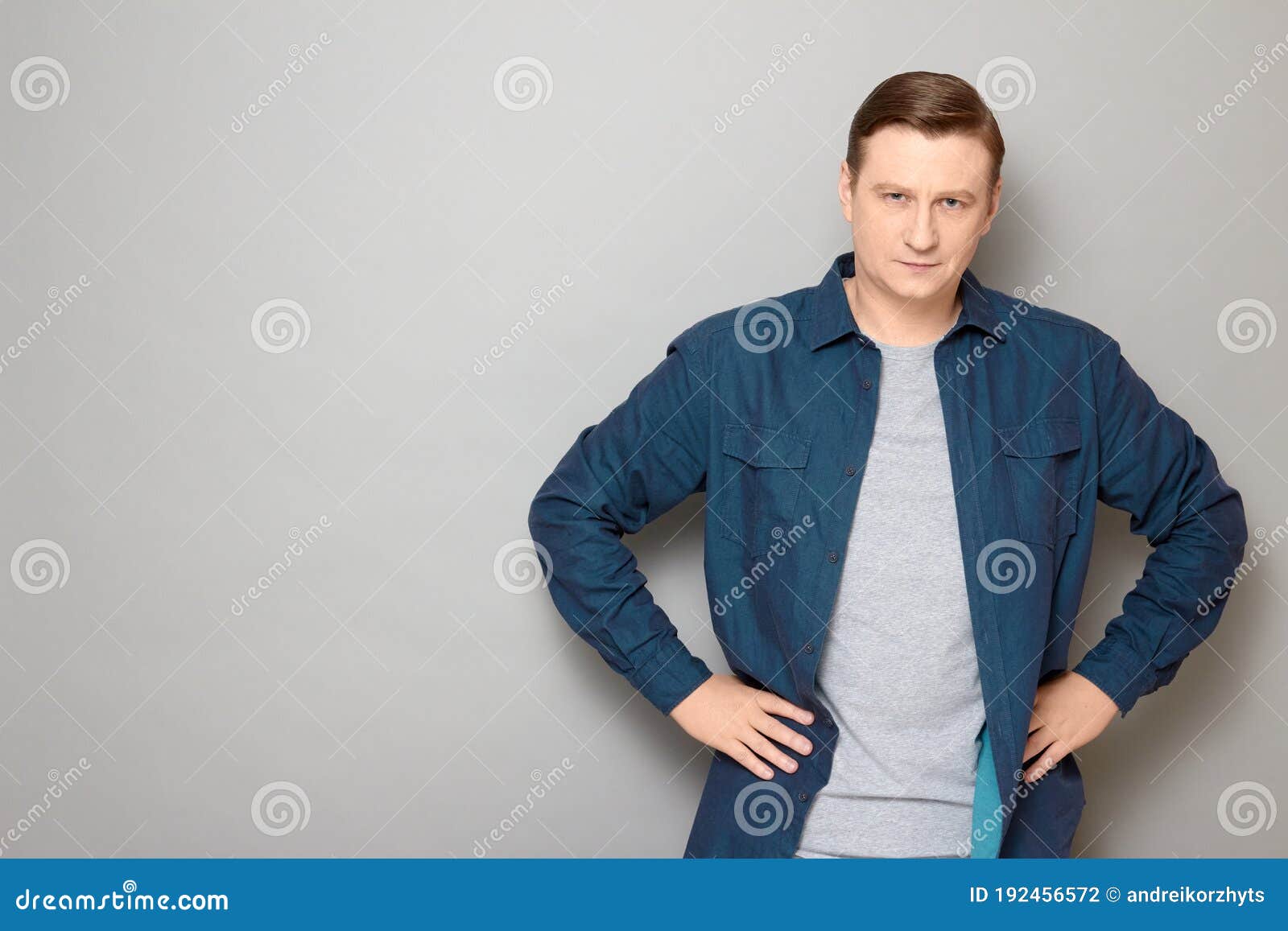 Portrait of Serious Focused Man Holding Hands on Hips Stock Photo ...