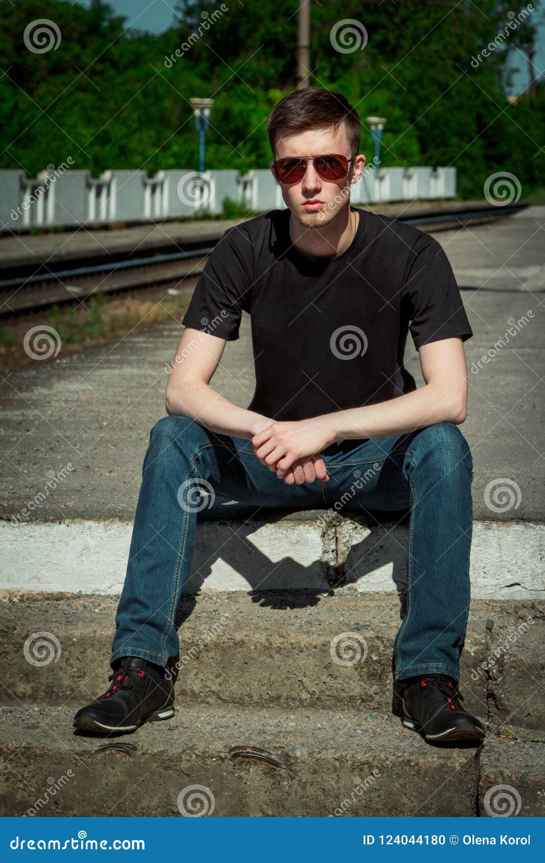 Portrait Serious Handsome Young Man Sitting on a Step at Railway ...