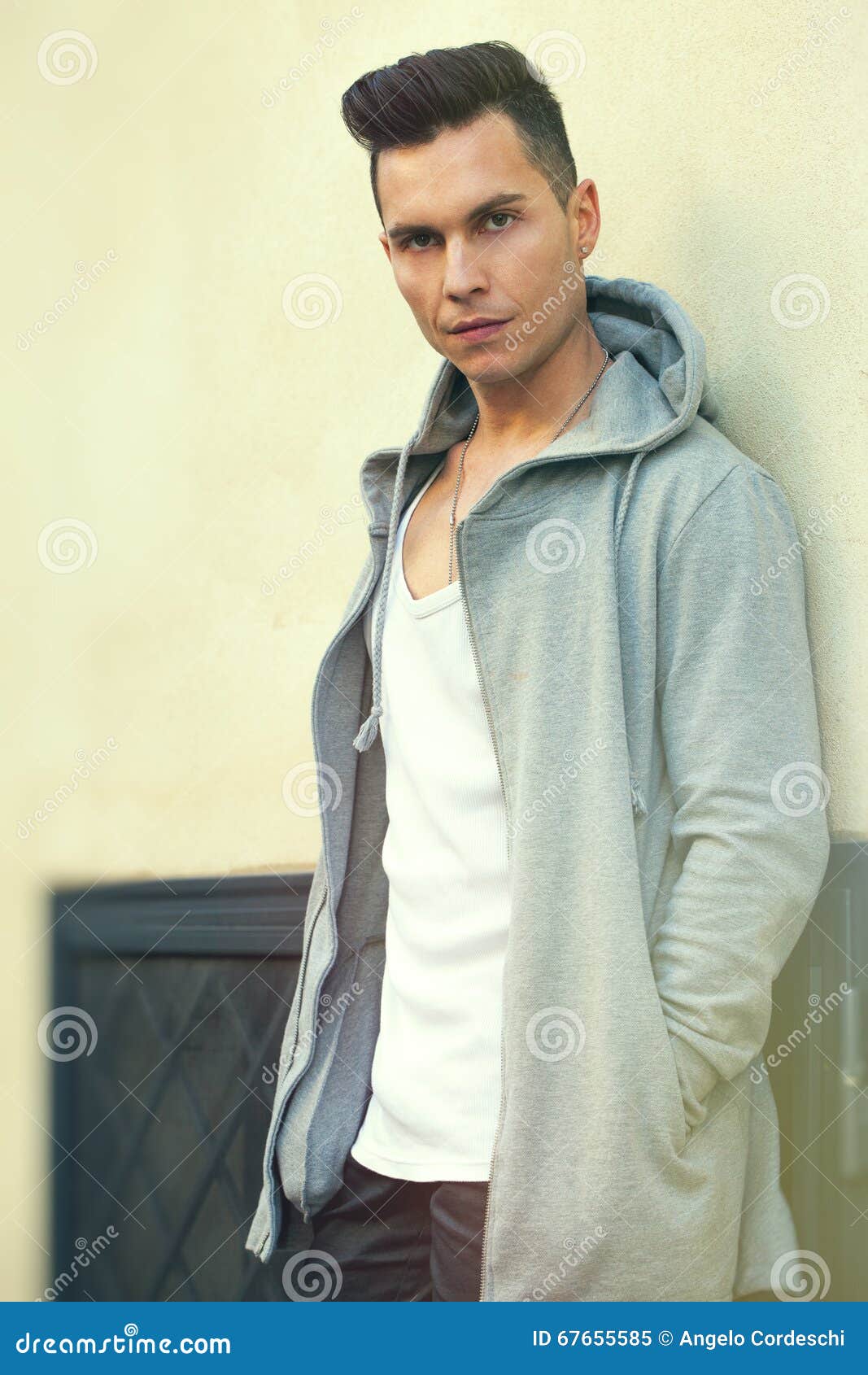 Portrait of Serious Young Man Leaning Against the Wall. Fashion Hair Style Stock Image - Image of casual, black: 67655585 Portrait of Serious Young Man Leaning Against the Wall. Fashion Hair Style Stock Image - Image of casual, black: 67655585