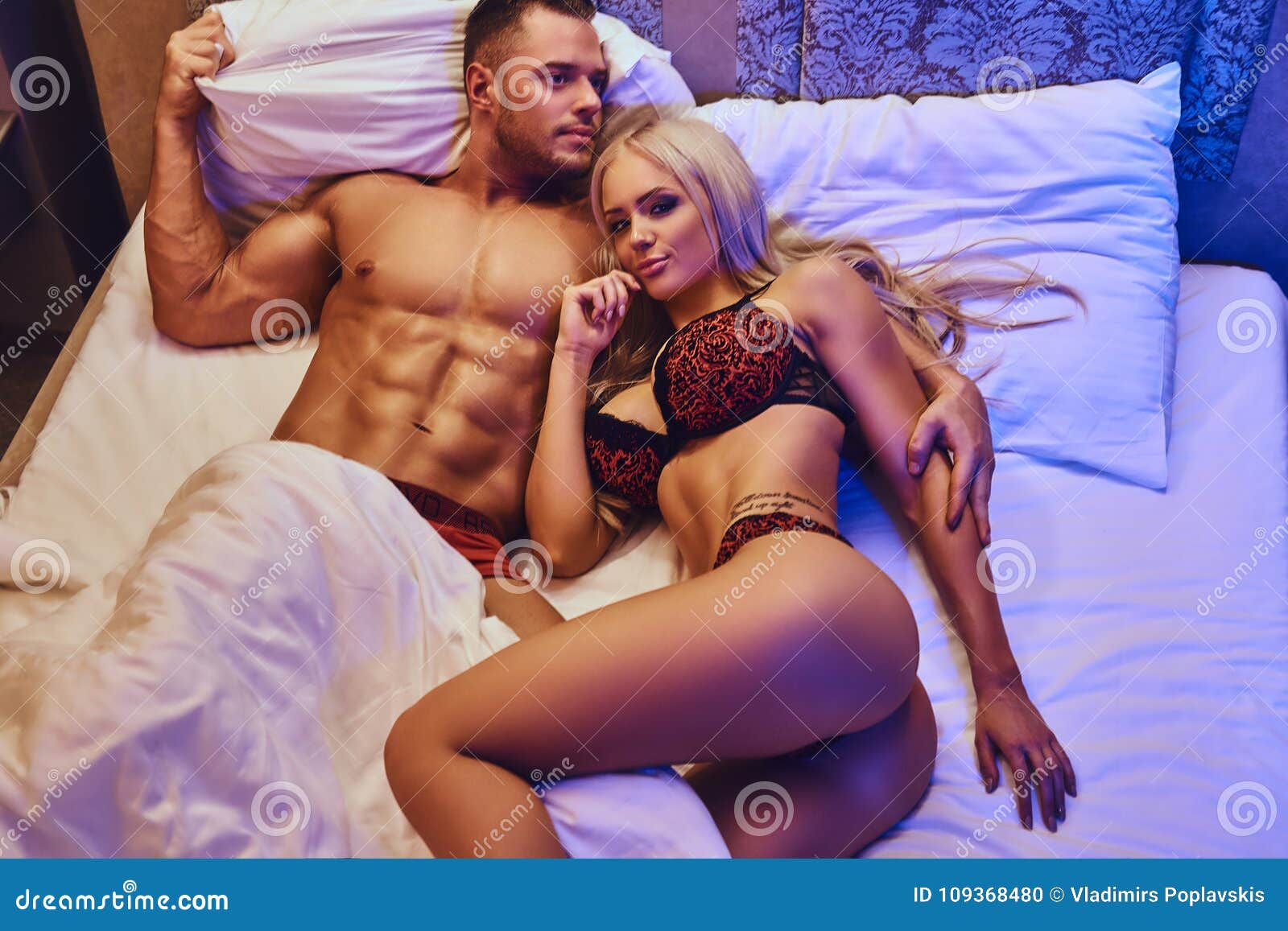Portrait of Husband and Wife, Relaxing in Bed, Honeymoon image