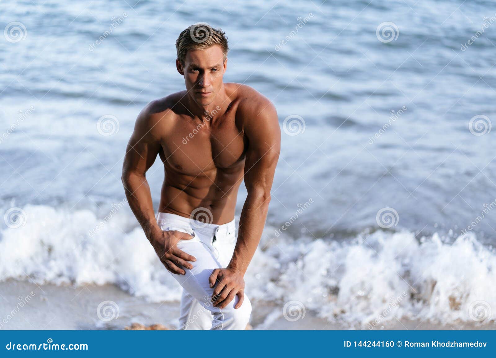 Shirtless on a beach stock photo. Image of posing, model 