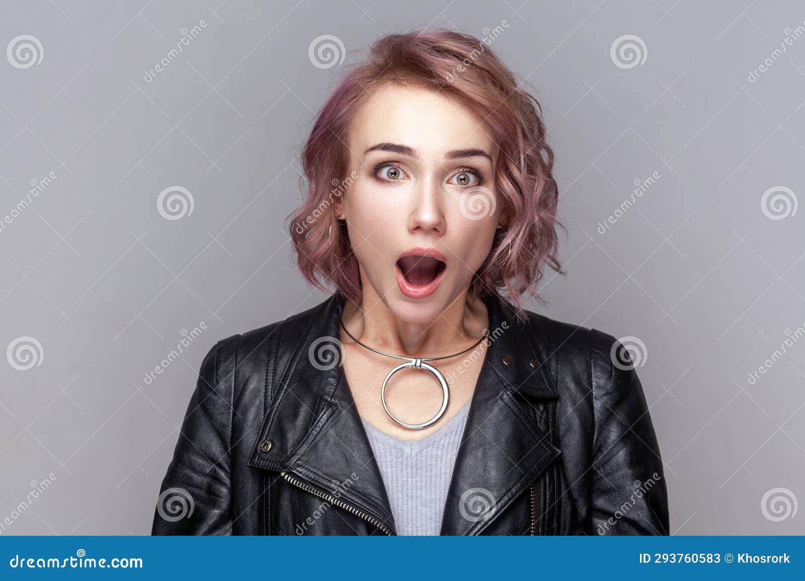 Shocked Amazed Surprised Woman Standing Looking At Camera With Big Eyes And Open Mouth Stock