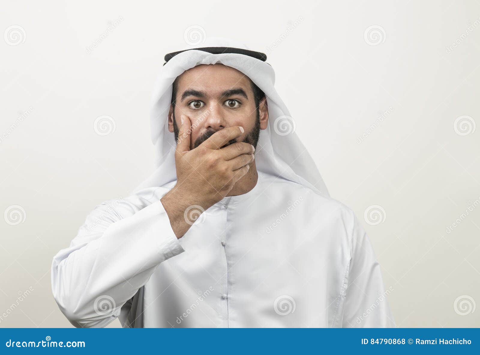 portrait-shocked-arabian-man-covering-his-mouth-arabian-g-guy-84790868.jpg