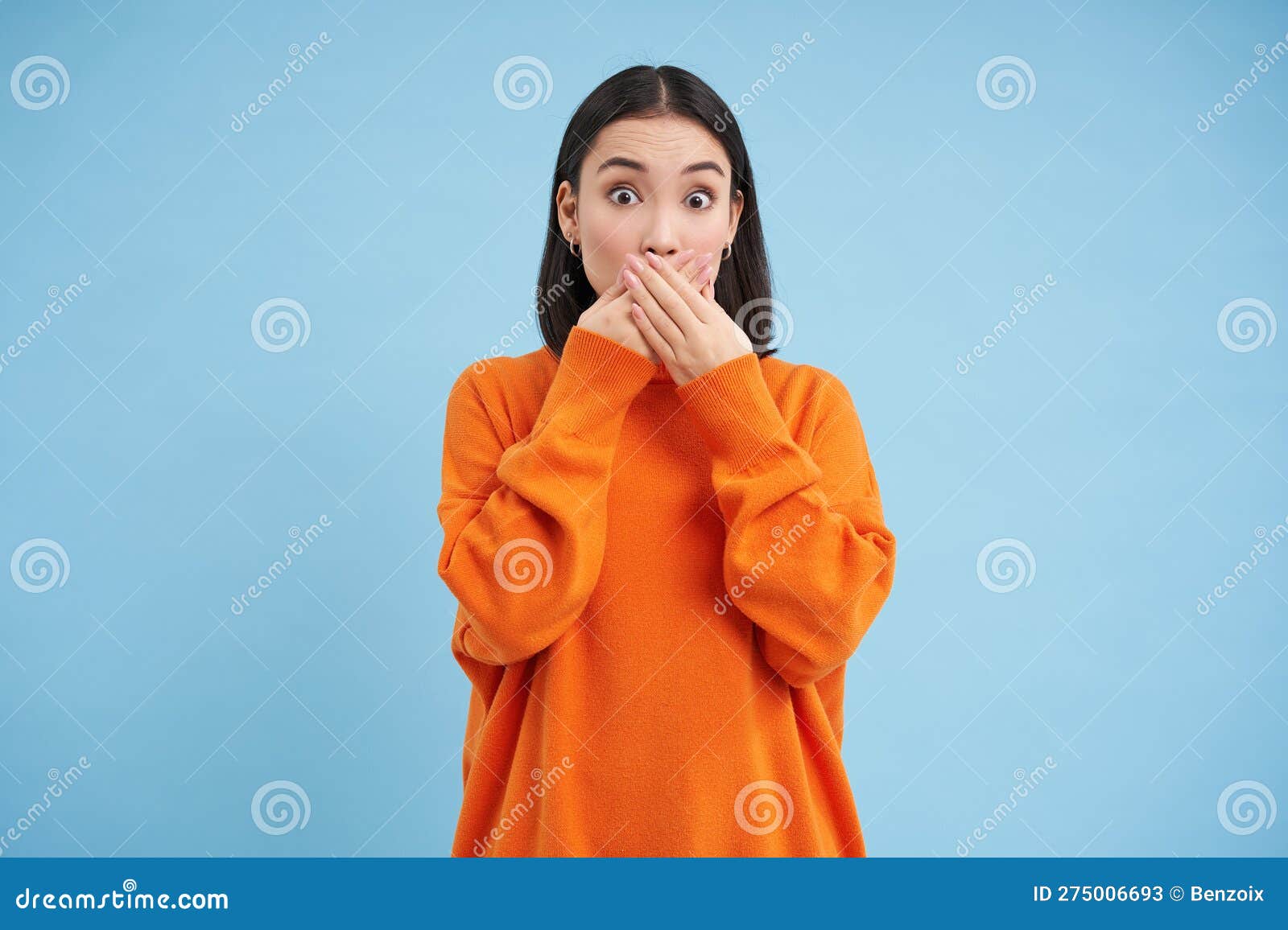 Portrait Of Shocked Korean Woman Gasps Closes Her Mouth With Hands And Look Speechless At