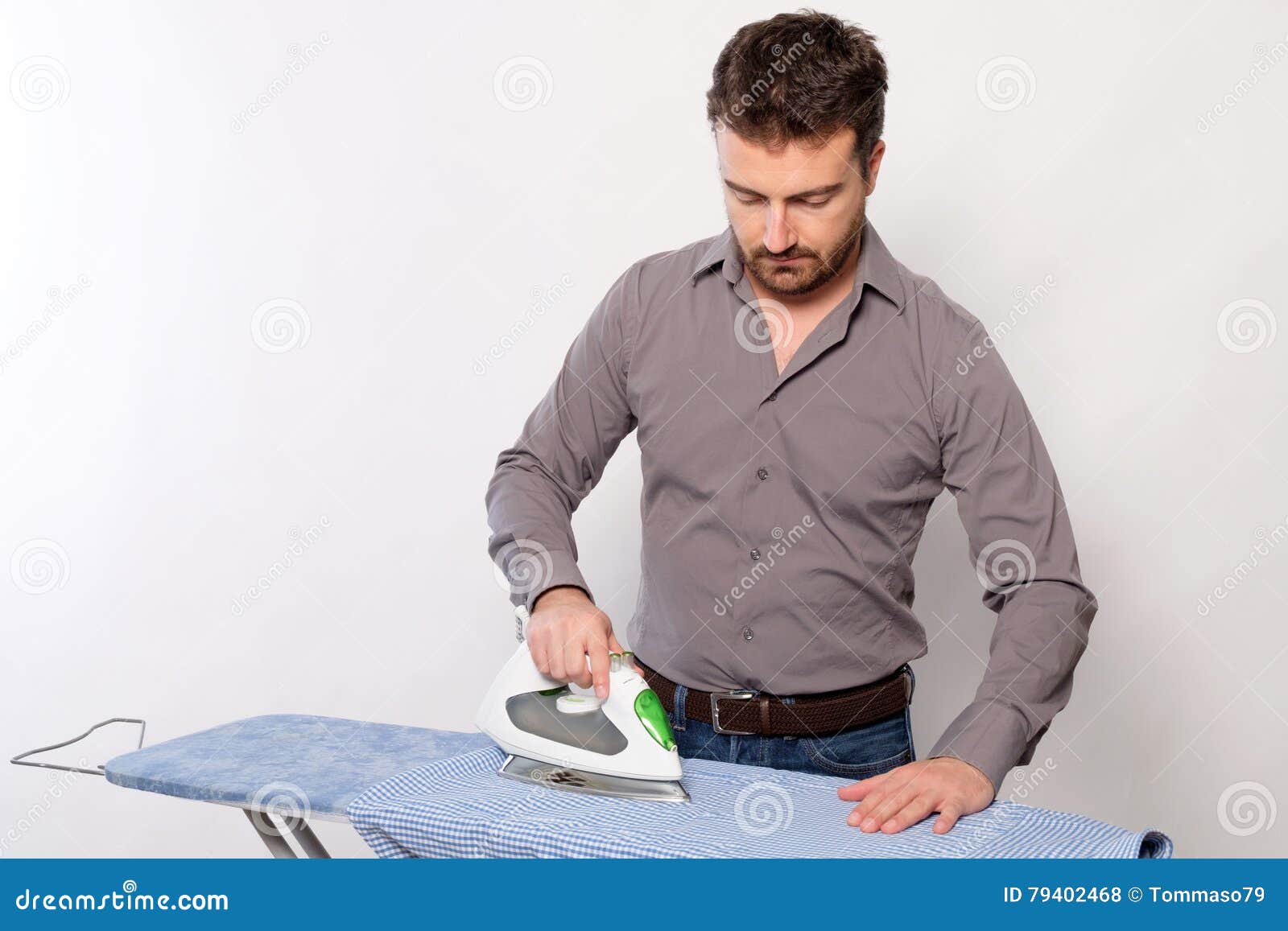 Portrait of Single Man Ironing a Shirt Stock Photo Image of