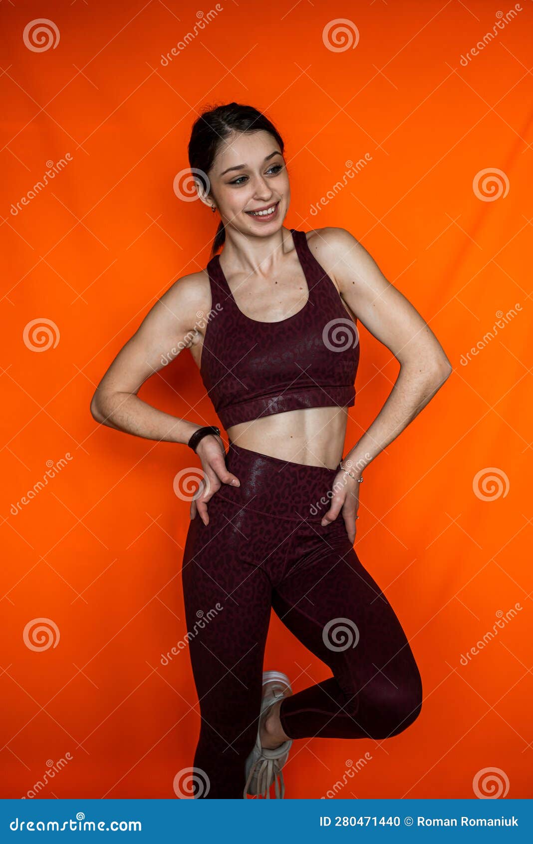 Portrait of Slim Woman Wear Sport Cloth Isolated on Orange