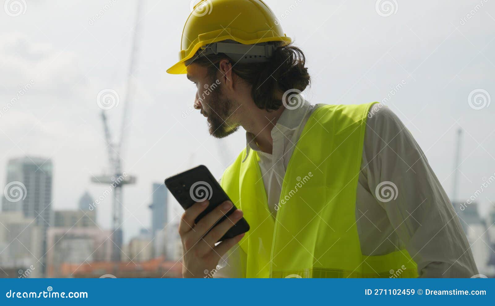 Portrait of Smart Engineer Foreman with Safety Helmet and Vest Stock