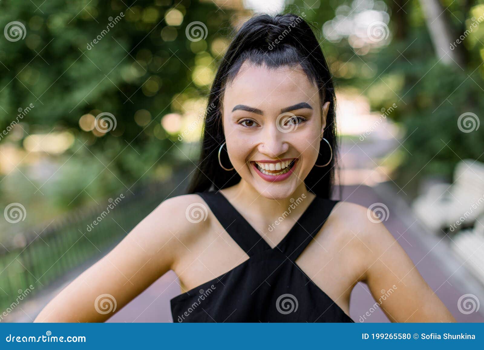 Portrait of Smiling Attractive Asian Girl with Ponytail Black Hair, Wearing  Summer Black Outfit, Relaxing and Enjoying Stock Photo - Image of face,  beauty: 199265580