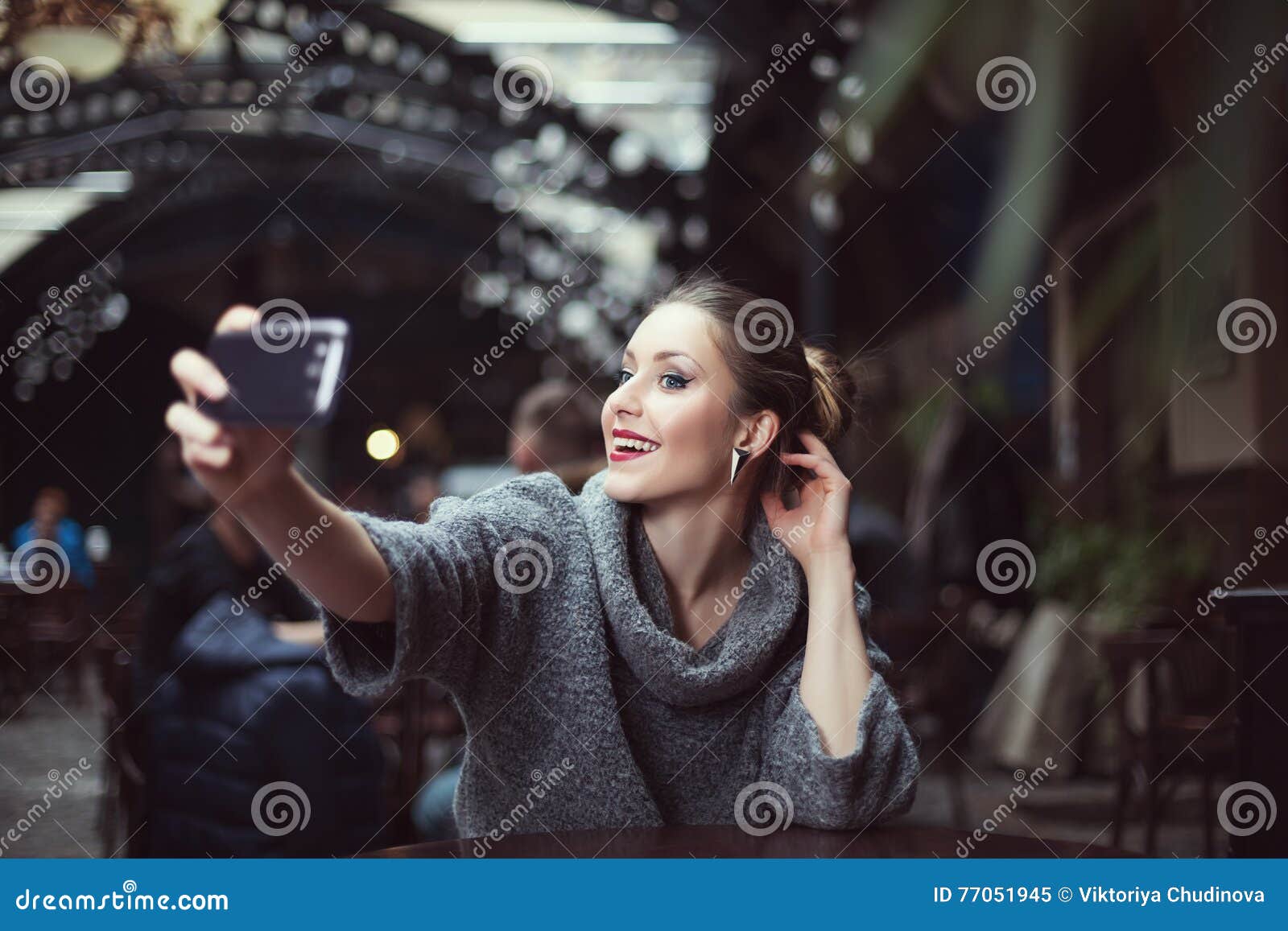 Portrait Of A Smiling Beautiful Young Woman Making Selfie Photo With