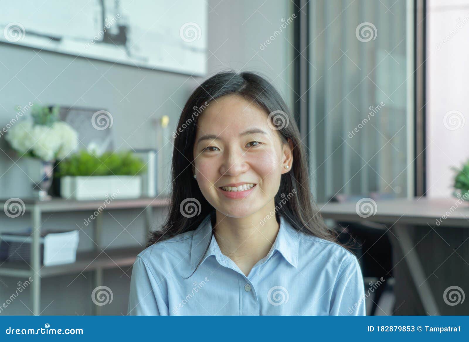 portrait of smiling business asian, chinese woman person working from home and talking to her colleagues in webcam group video