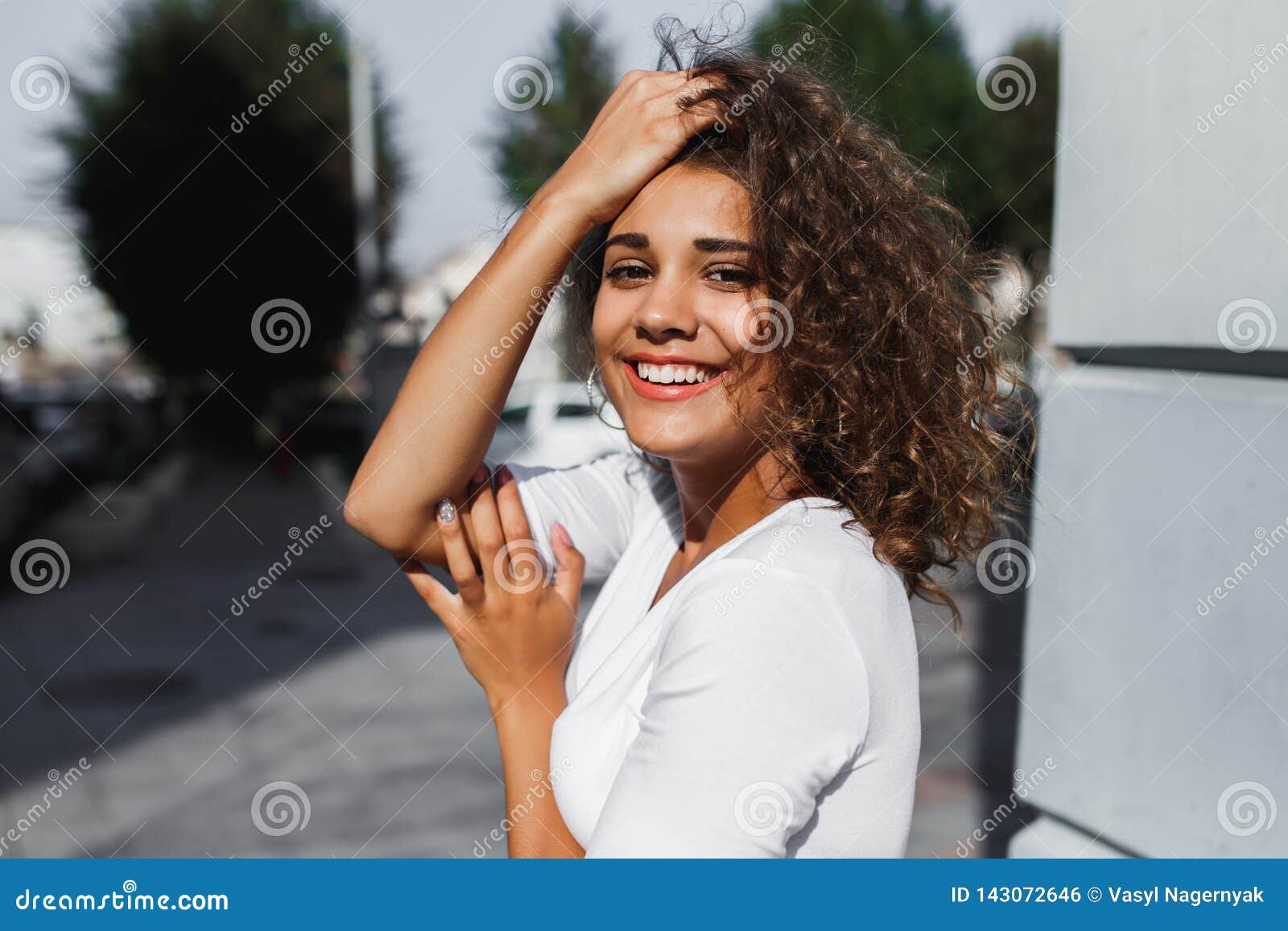 Portrait of Smiling European Woman with Brunette Curly Hair Stock Photo ...