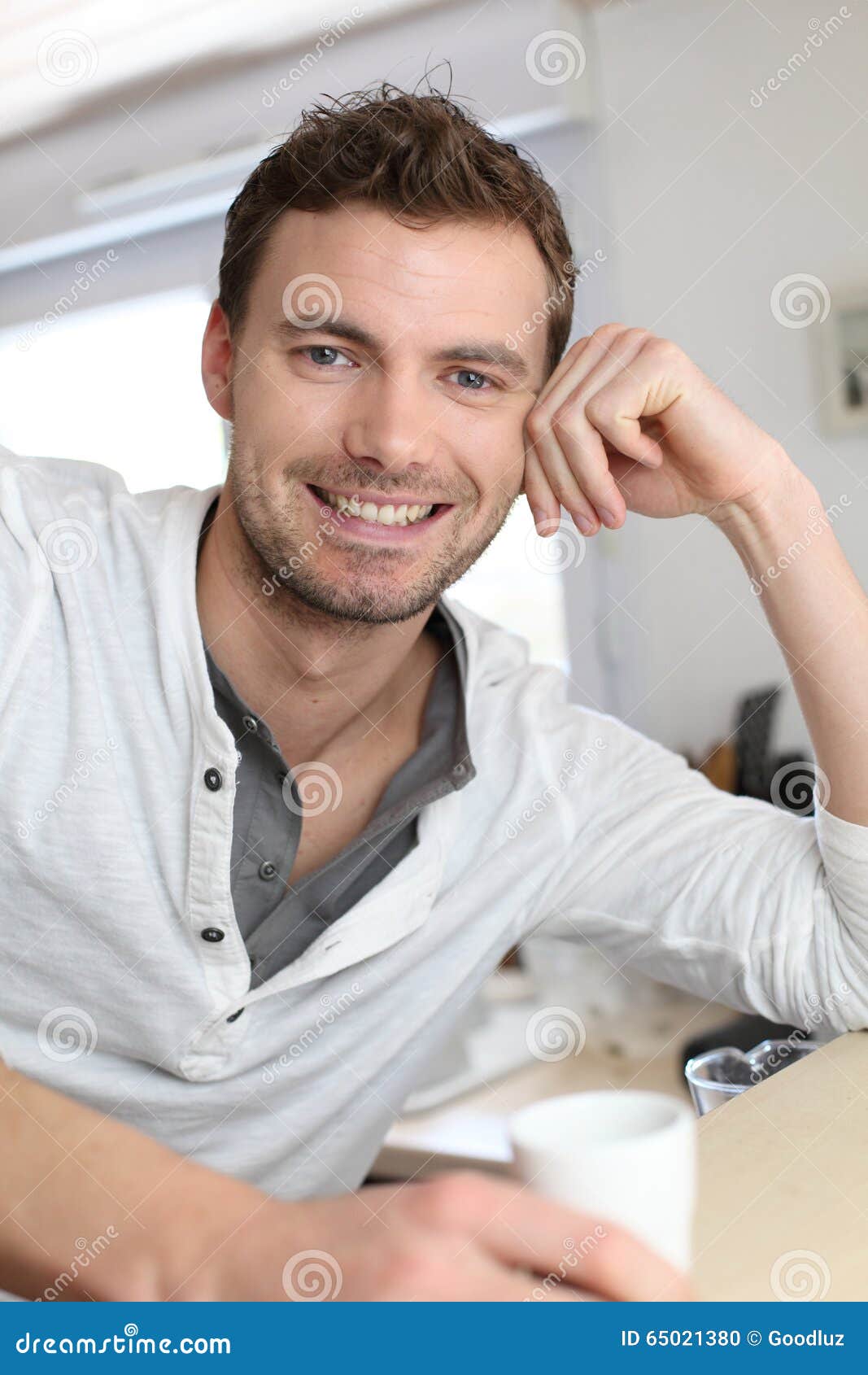 Portrait of Smiling Handsome Man with Cup of Coffee Stock Photo Image