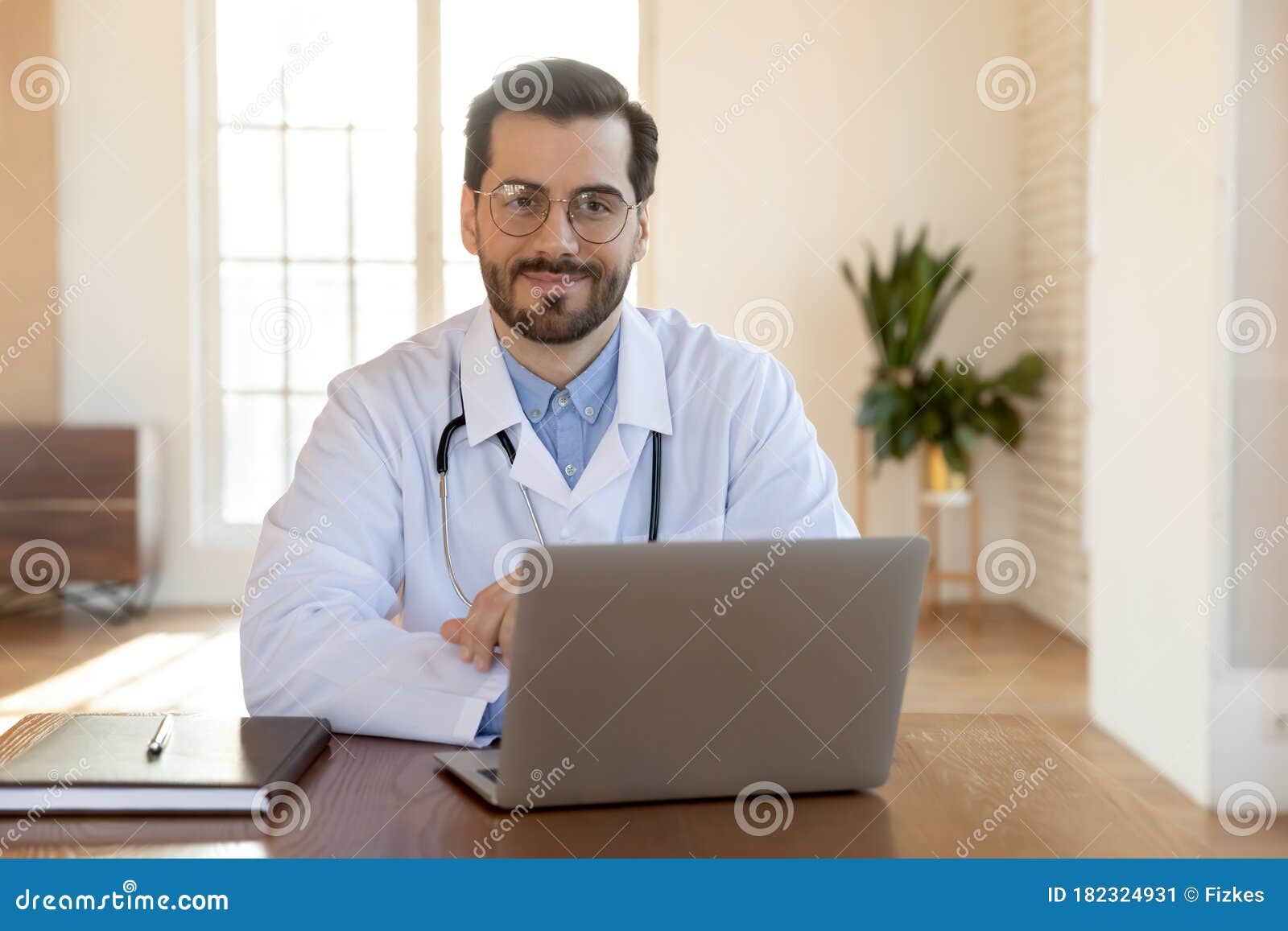 Portrait of Smiling Male Doctor Posing at Workplace Stock Image - Image ...