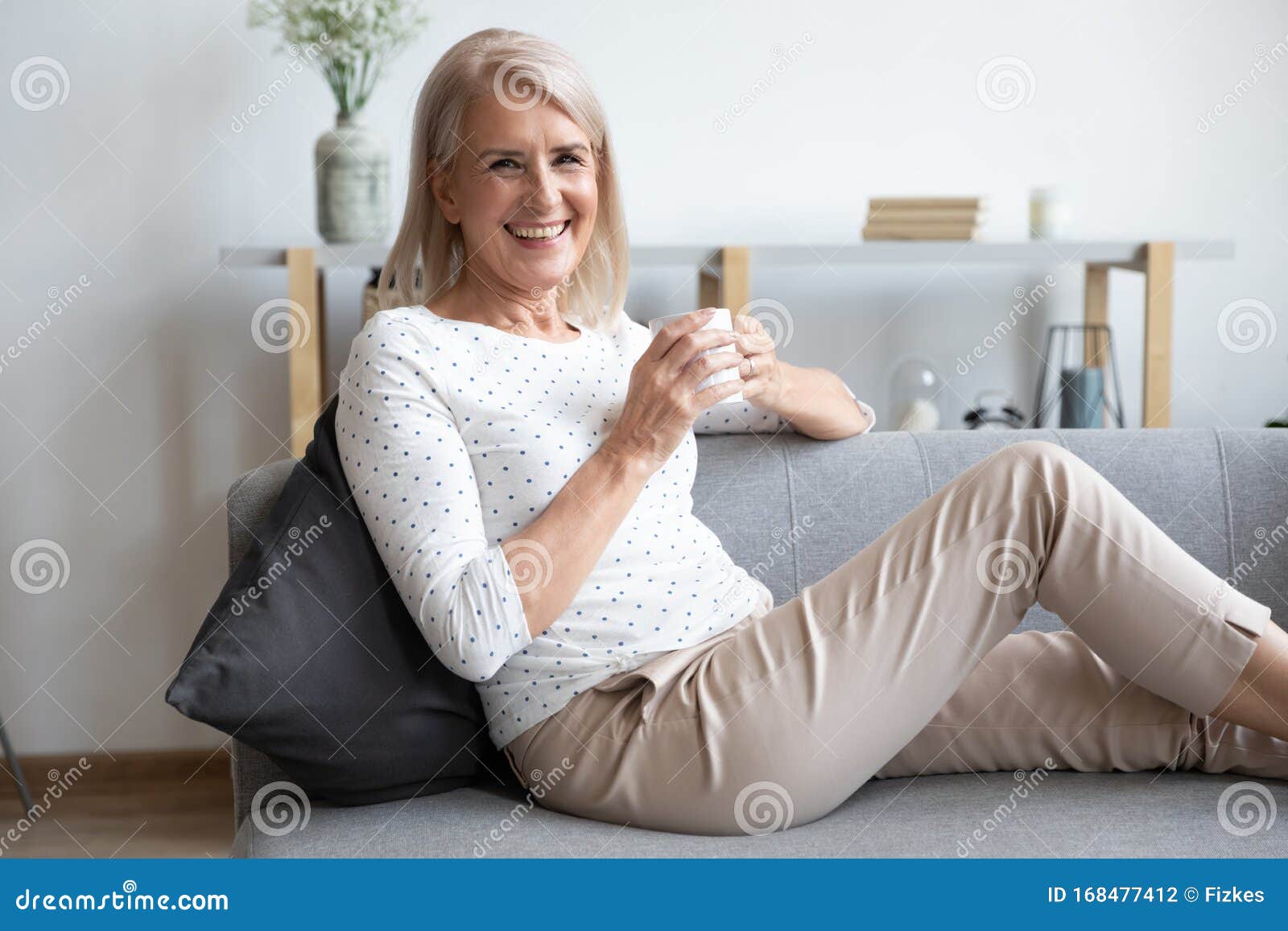 Happy Joyful Older S Woman Sitting On Couch At Home Stock Photo | My ...