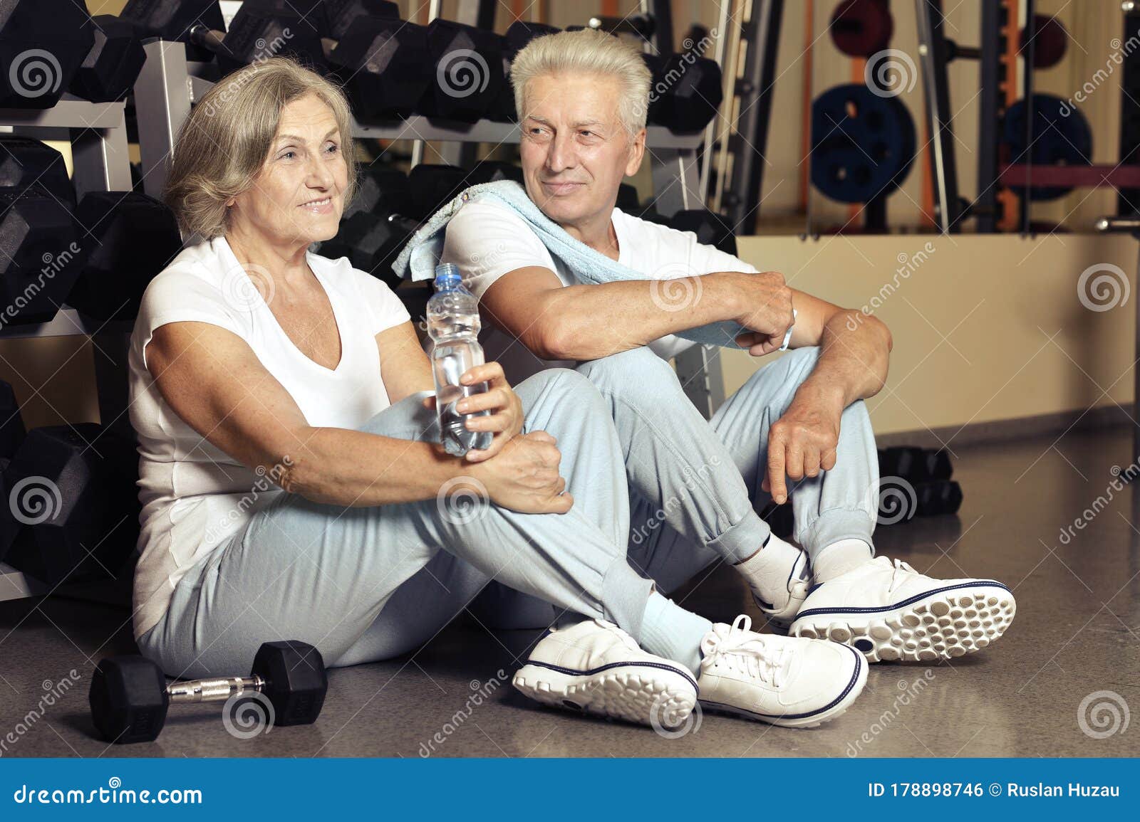 Portrait Of Senior Couple Drinking In Gym Stock Photo Image Of