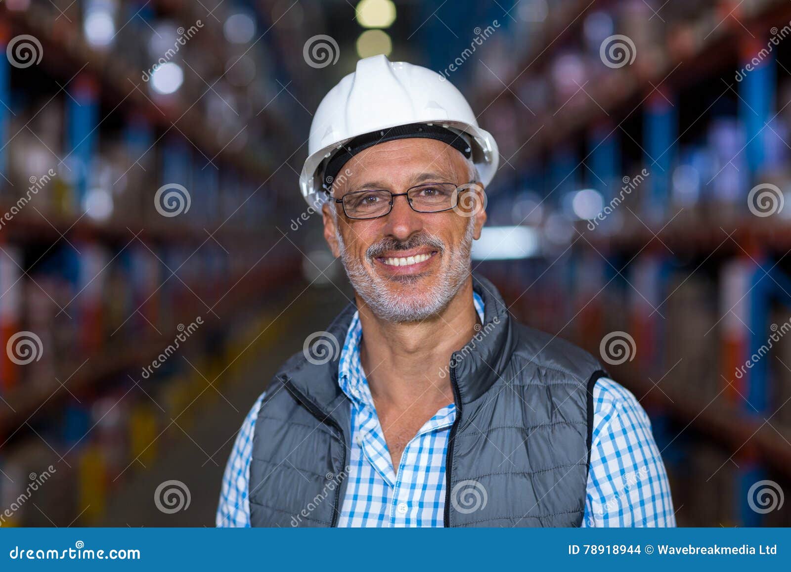 Portrait of Smiling Warehouse Worker Wearing Hard Hat Stock Photo