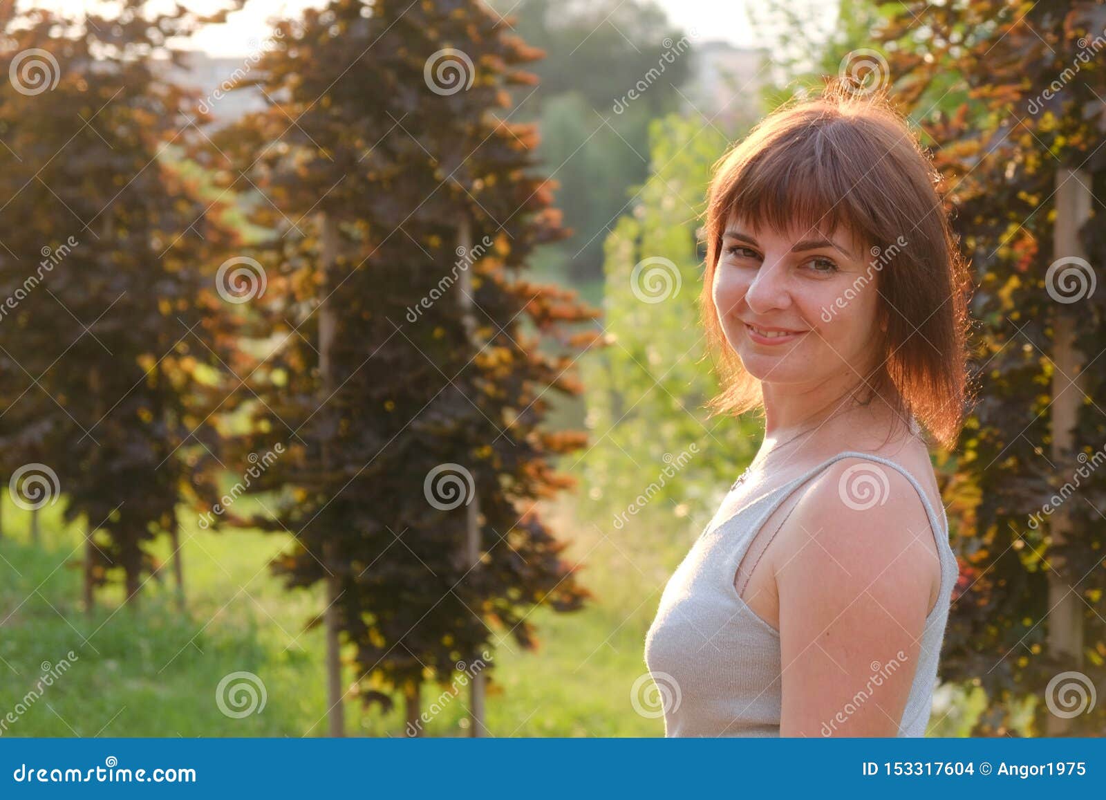 Portrait of a Smiling Woman 40 Years Walking in Park at Sunset Stock ...