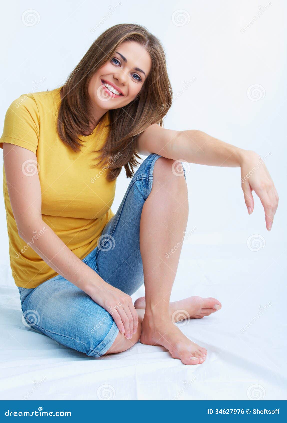 Portrait Of Smiling Young Woman Seating On Floor Stock Photo - Image of ...