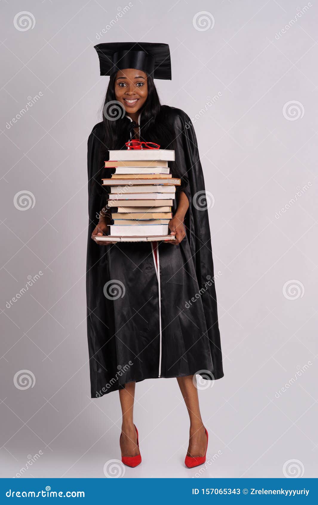 Young Woman in a Graduation Gown · Free Stock Photo