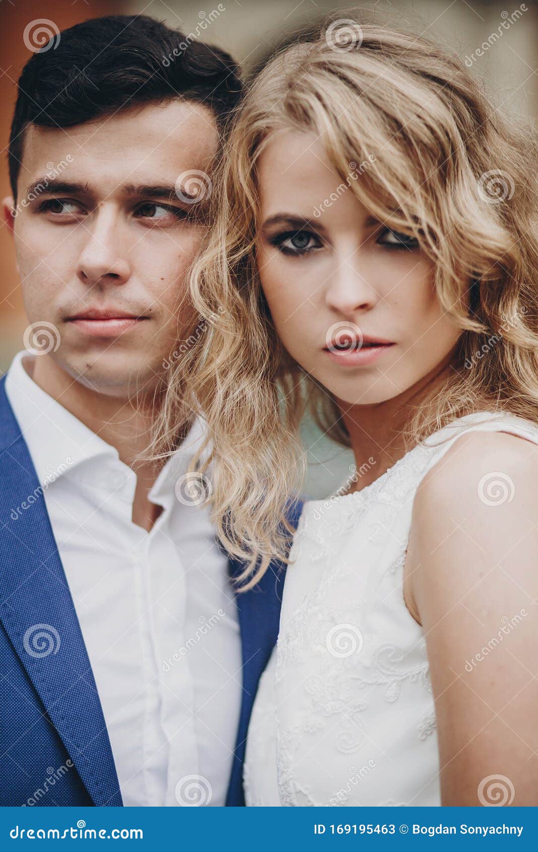Portrait of Stylish Couple Embracing in European City Street. Sensual