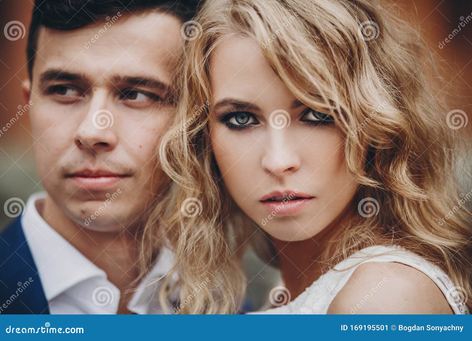 Portrait Of Stylish Couple Embracing In European City Street Sensual Romantic Moment Stock