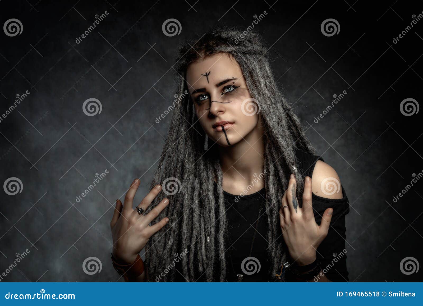 Portrait of a Young Woman with Dreadlocks Against Dark Background Stock ...