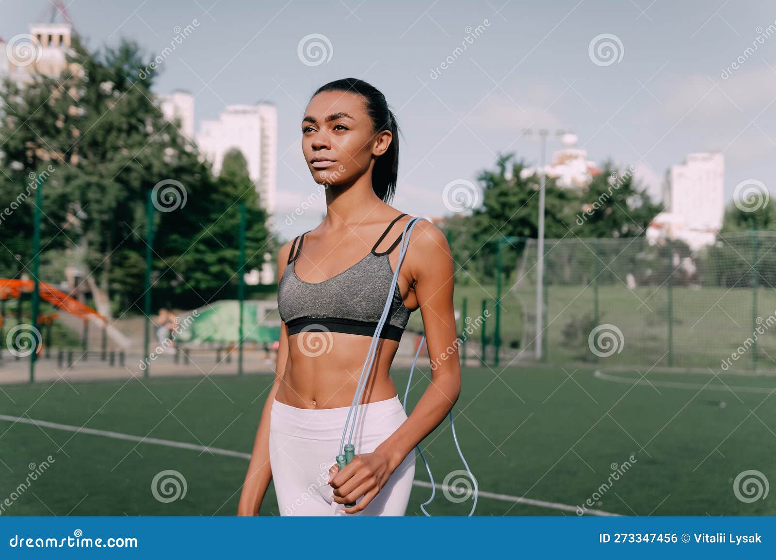 Portrait of Sweaty African American Fit Woman with Skipping Rope