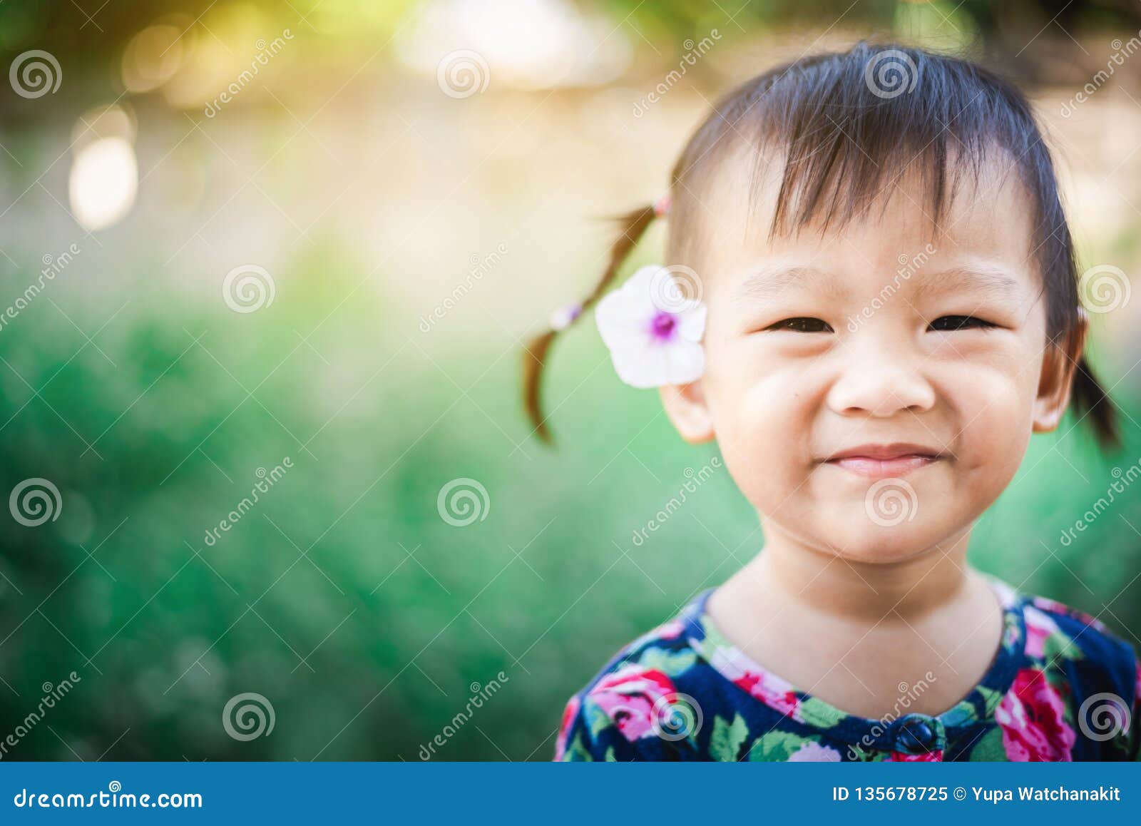 Sweet Asian Child Little Girl Smiling with Flower on Her Ear Stock ...