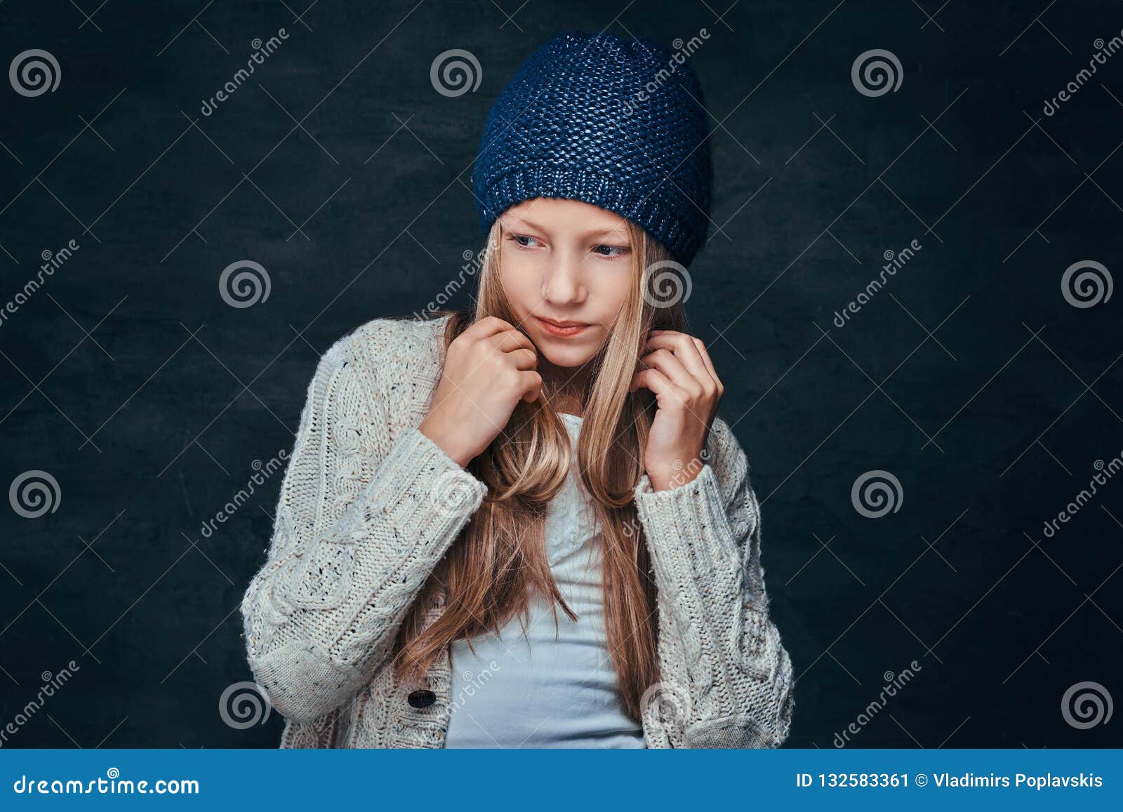 Portrait of a Teen Girl with Blonde Hair Wearing a Winter Hat and ...